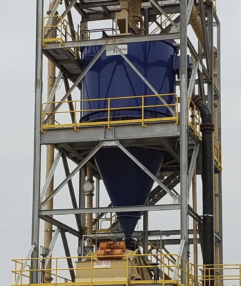 A large blue tank sitting on top of a metal structure.