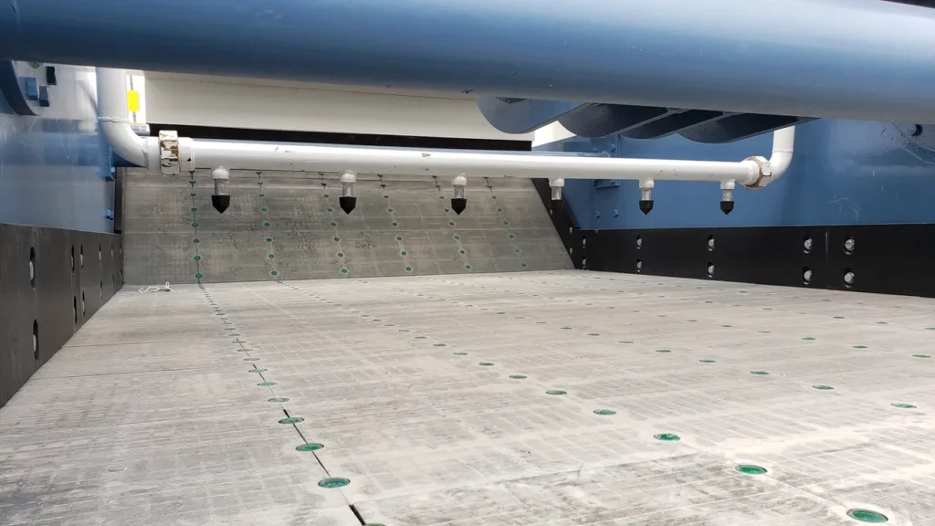 A large concrete area with several guns on it.