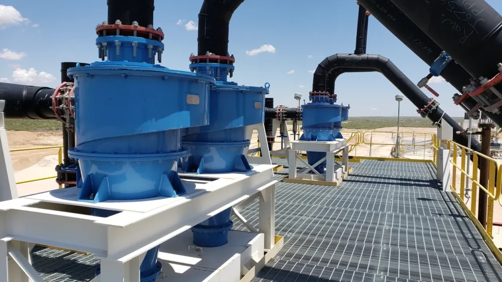 A couple of blue and white machines on top of a platform.