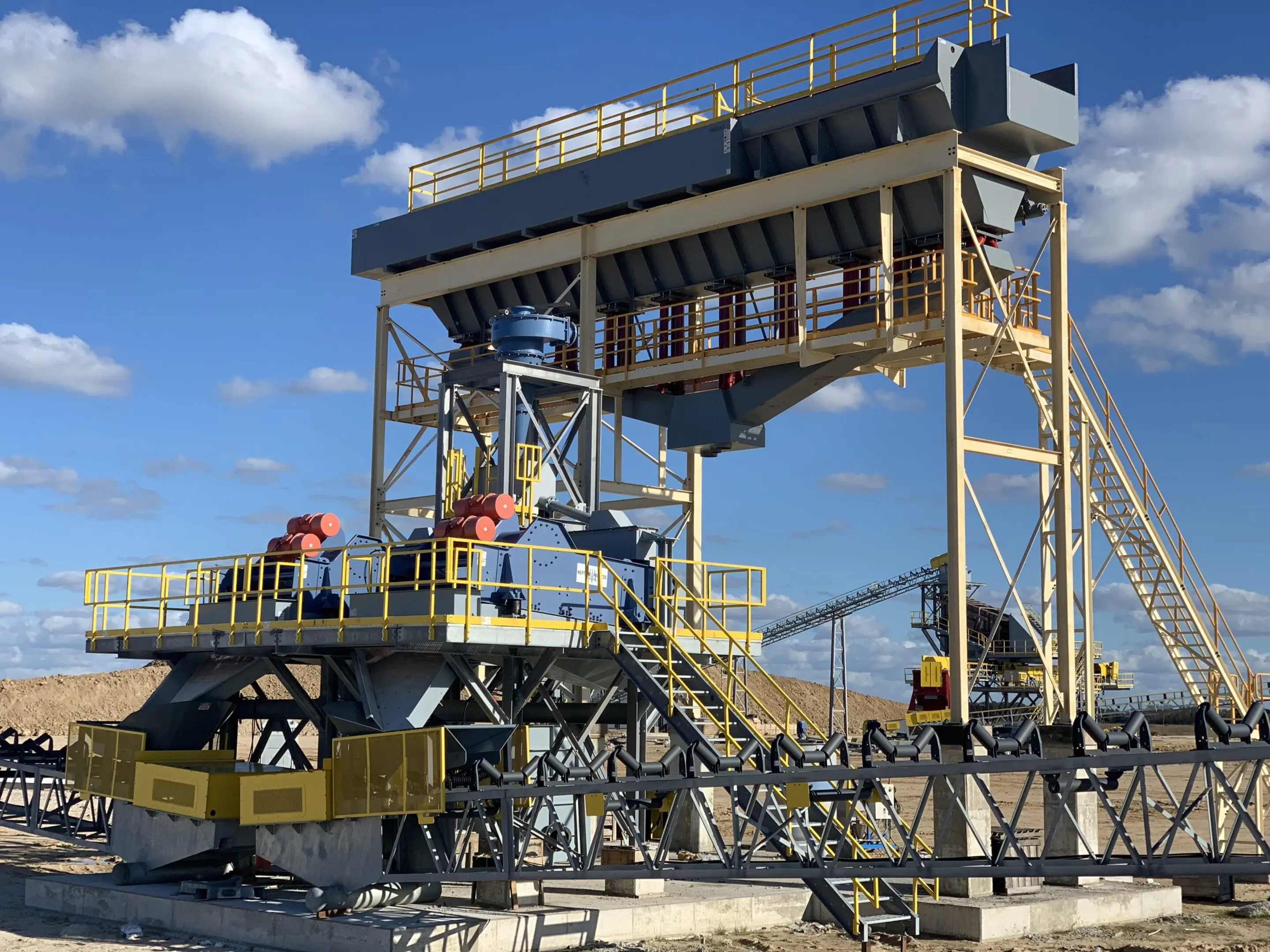 A large metal structure with people working on it.